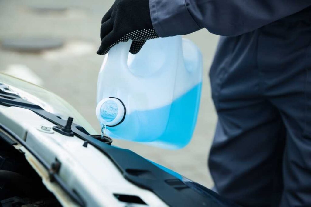 Adding coolant during a vehicle fluid service